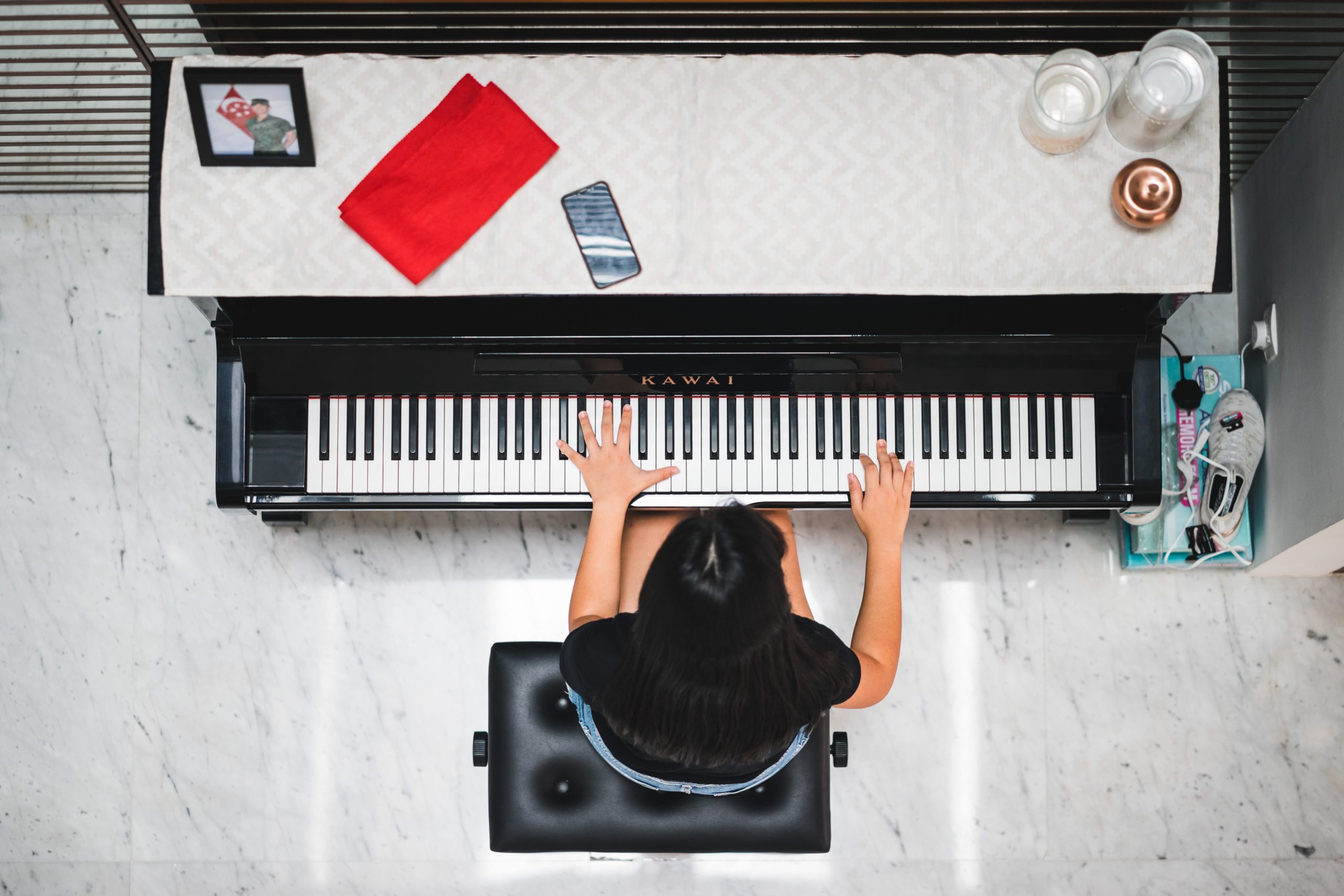 aerial view of girl playing piano